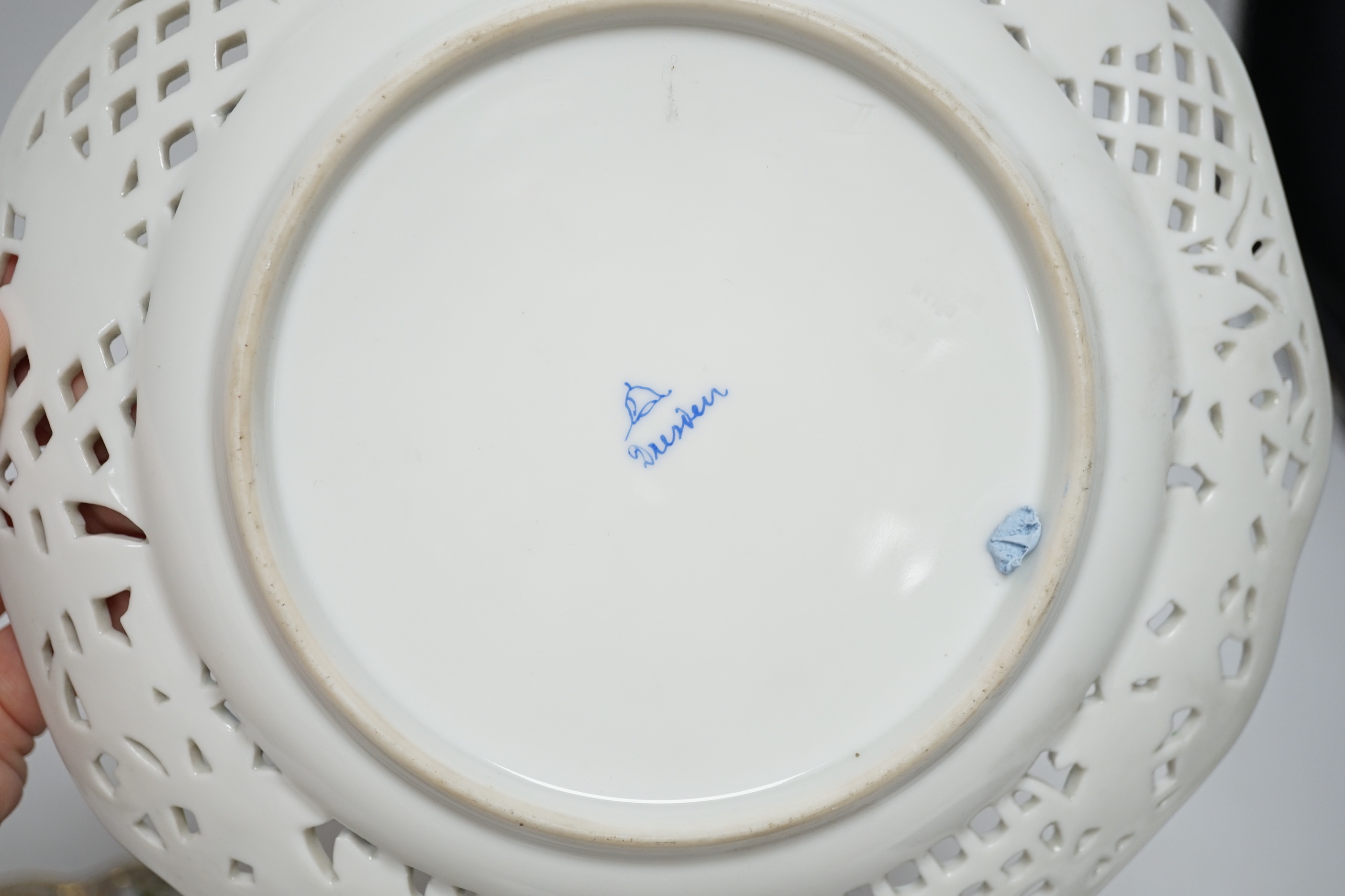 A pair of Dresden blue cabinet plates decorated with central cartouche of lovers, 22cm diameter